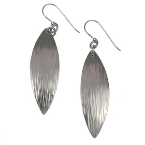 1 of 5: A Pair of Chased Stainless Steel Leaf Drop Earrings on a White Background