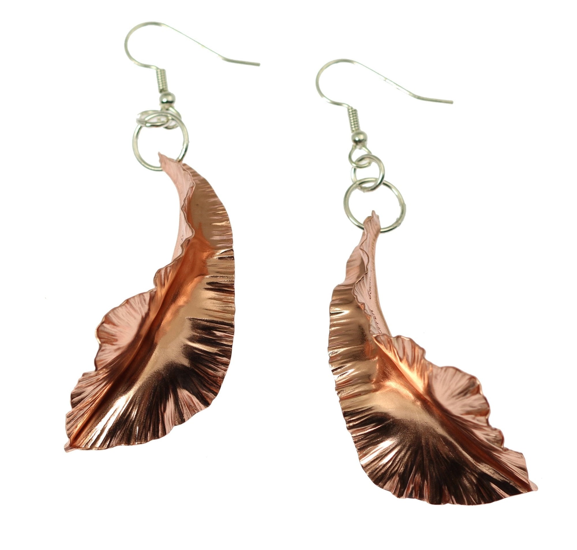 A Pair of Copper Fold Formed Leaf Dangle Earrings on a White Background