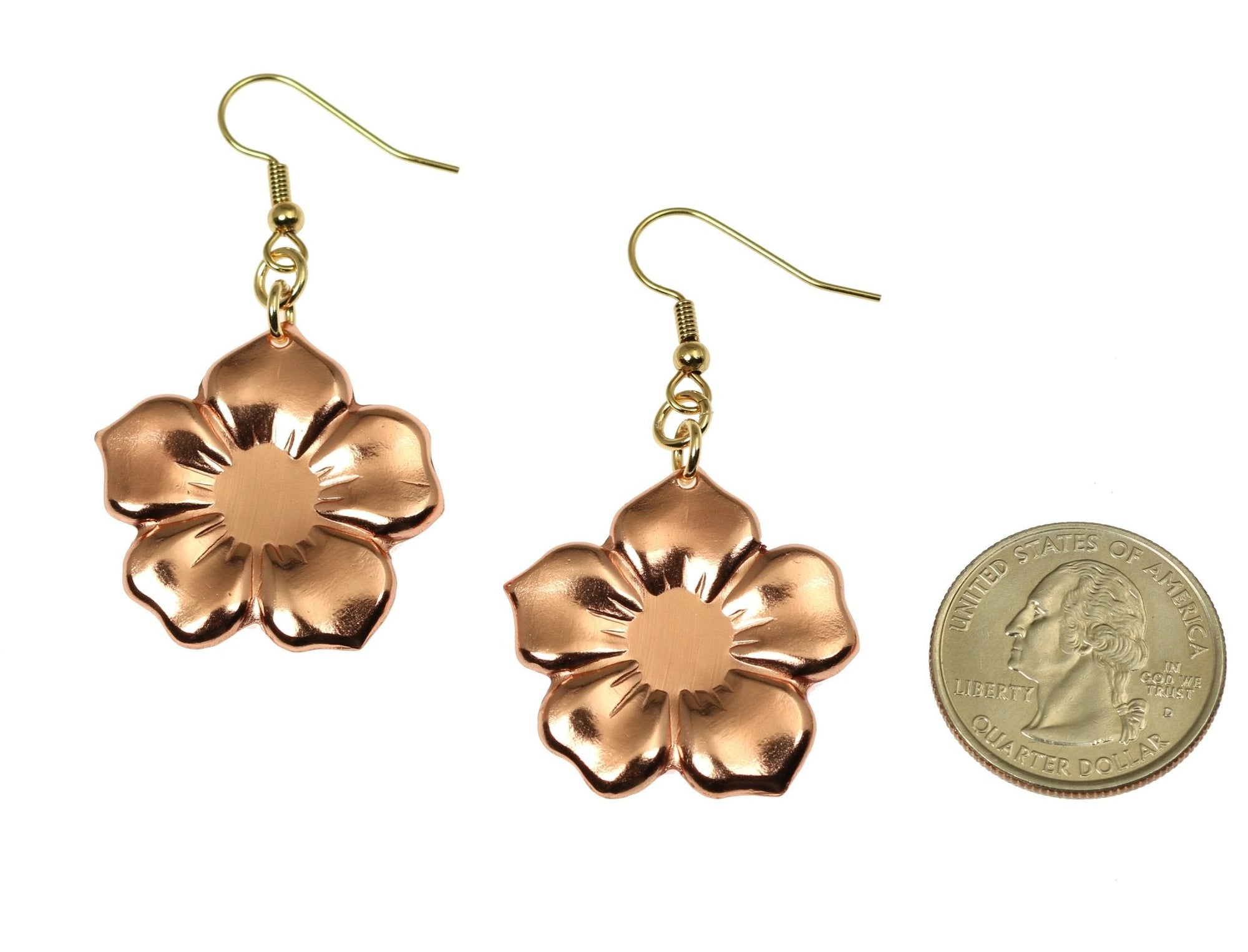 Size of Copper Forget Me Not Flower Earrings compared to a US Quarter Coin