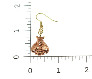 3 of 6: Scale of Copper Honey Bee Drop Earrings on a Ruler for Size Dimensions