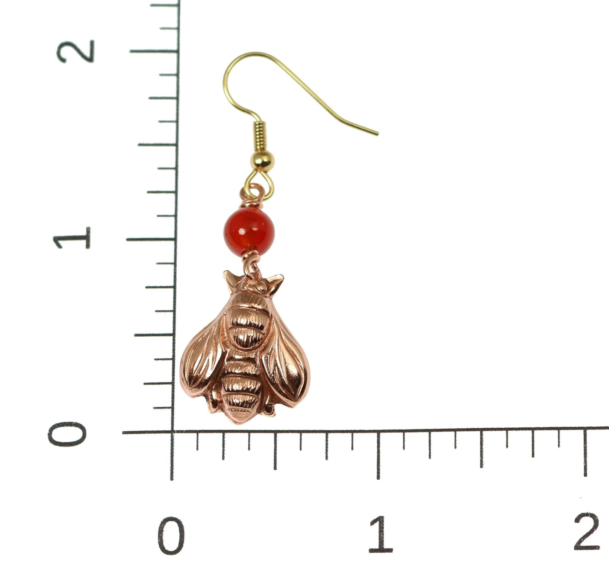 Scale of Copper Honey Bee Drop Earrings With Carnelian on a Ruler for Size Dimesions