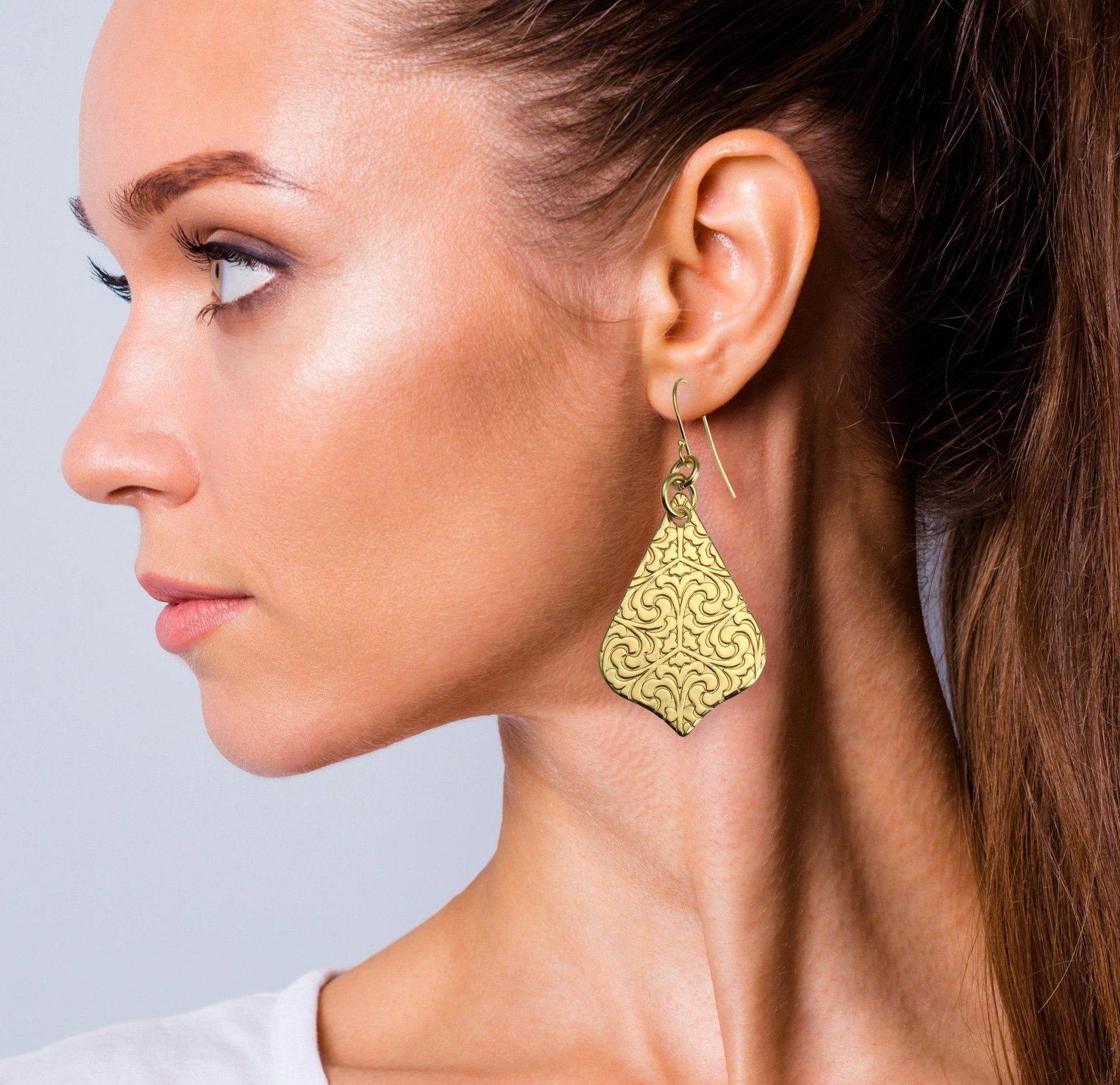 Damask Embossed Brass Nu Gold Drop Earrings on Female Model