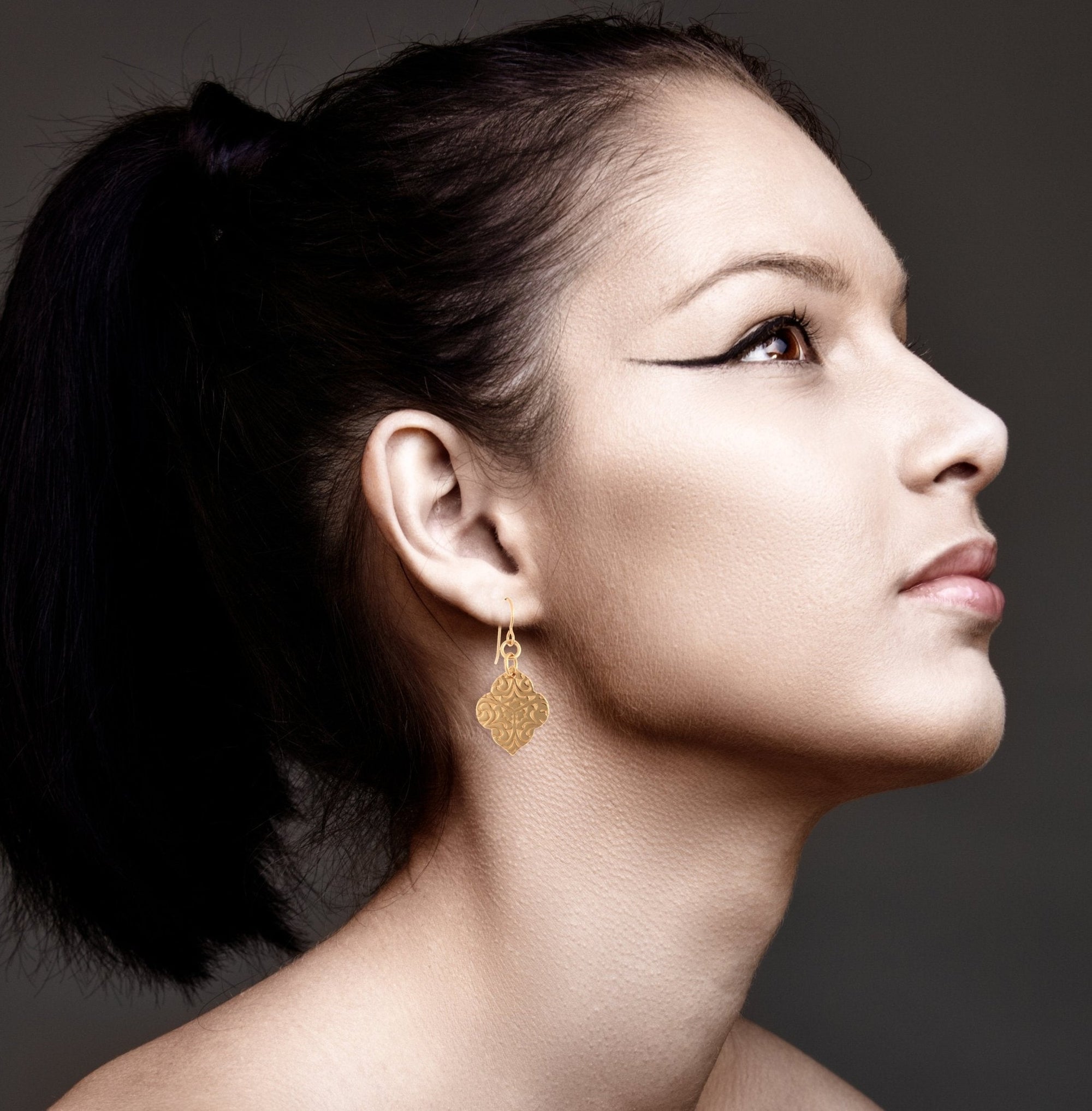 Damask Embossed Bronze Quatrefoil Earrings on Female Model