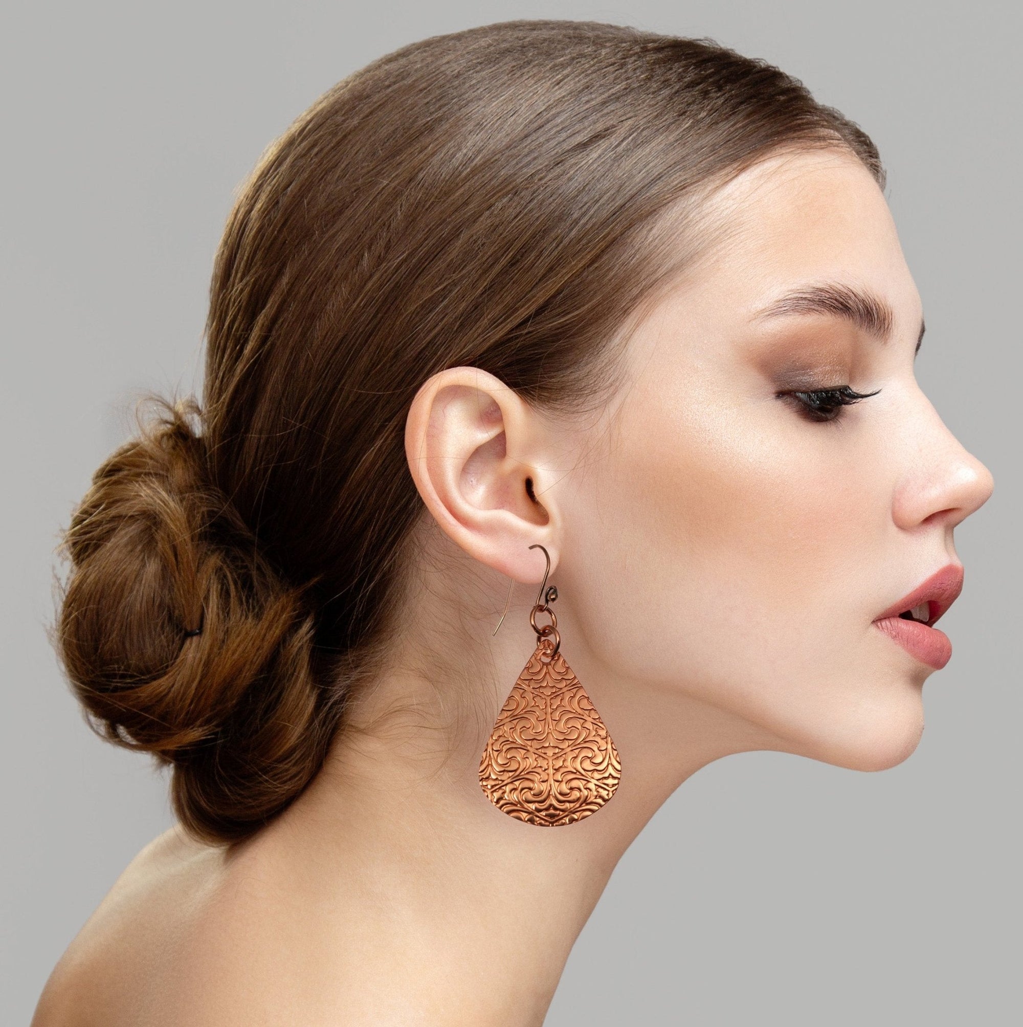 Female Model Wearing Damask Embossed Copper Drop Earrings