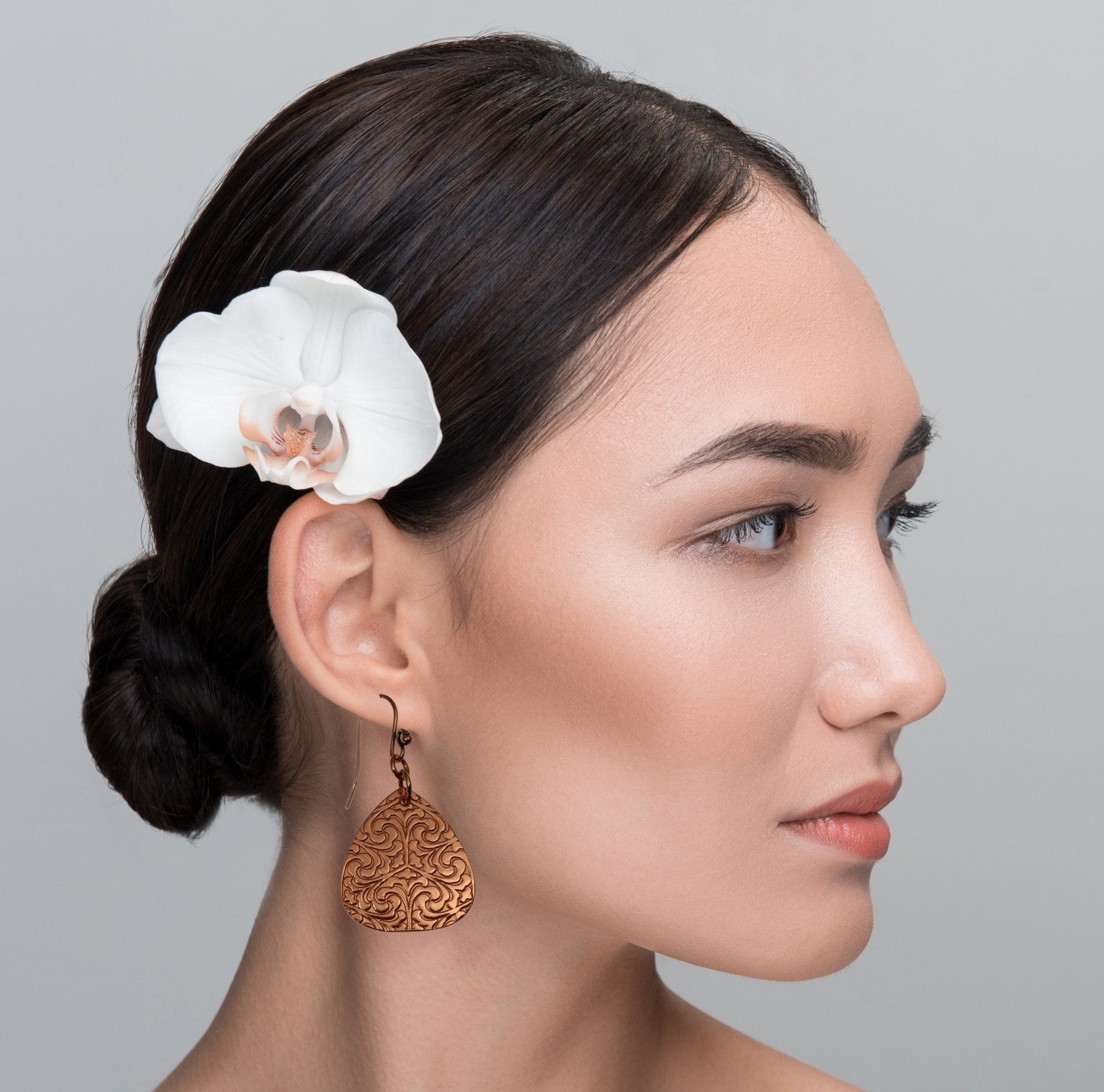 Female Model Wearing Damask Copper Triangle Drop Earrings