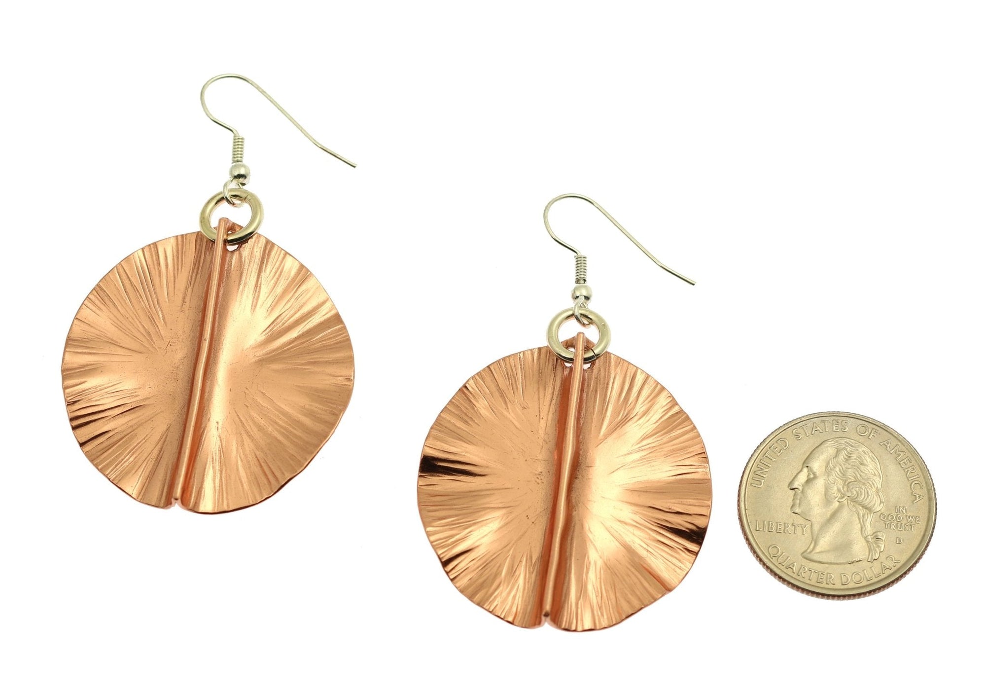 Size of Fold Formed Copper Lily Pad Earrings compared to a US Quarter Coin