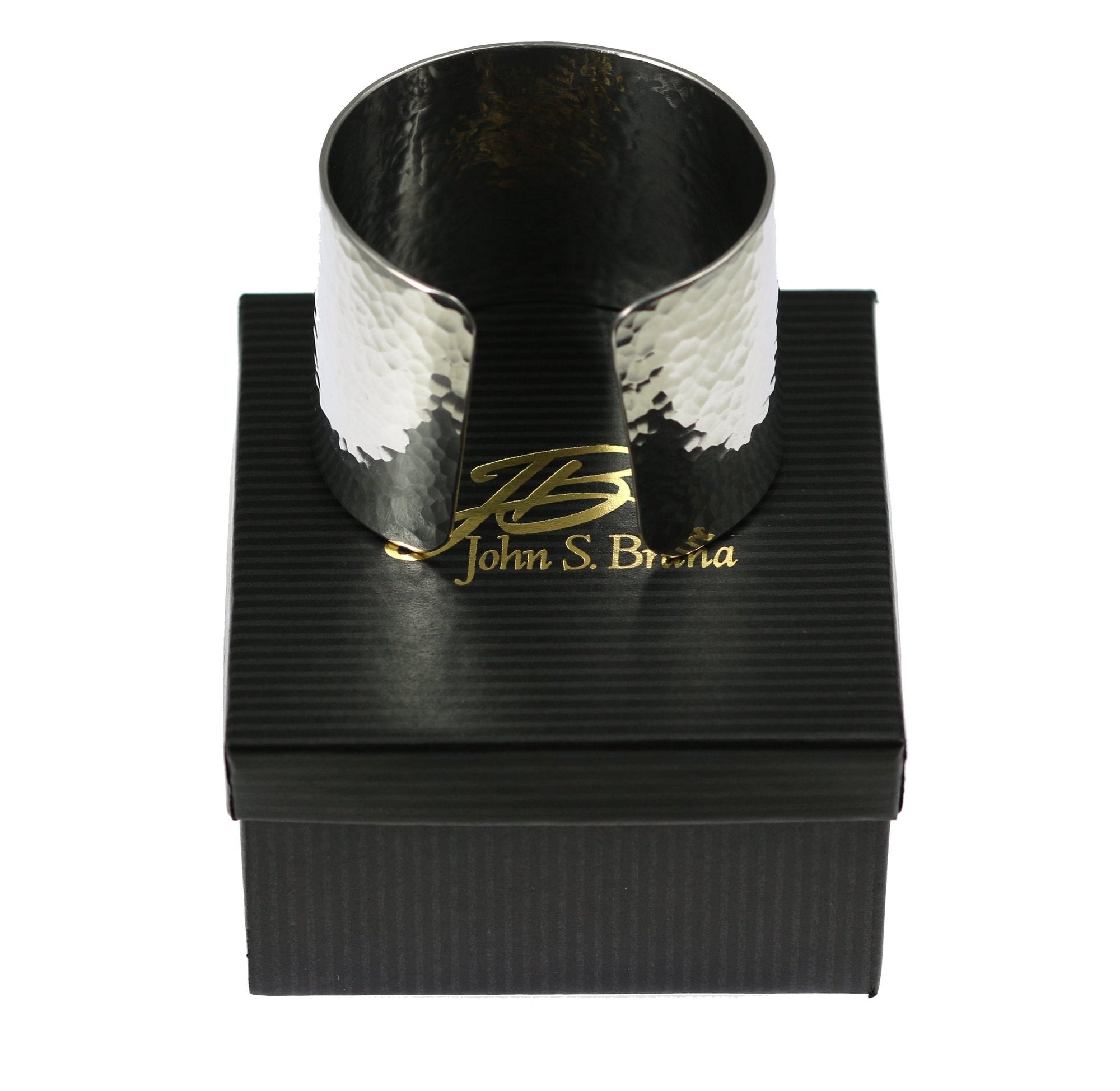 Hammered Aluminum Cuff Bracelet on top of a Black Gift Box