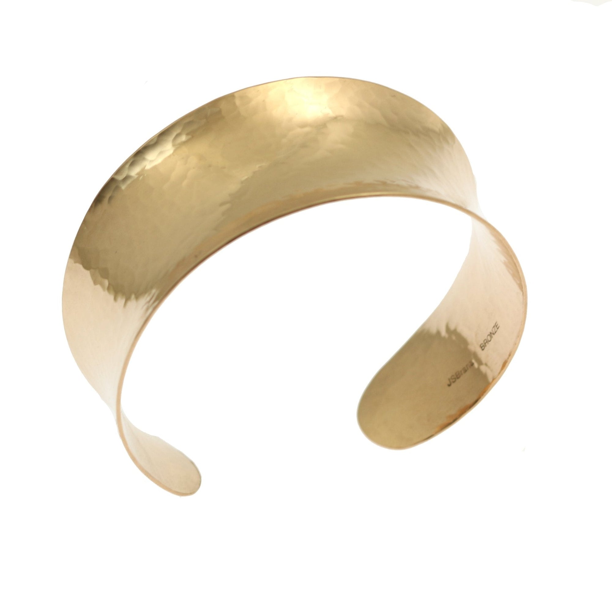 A Hammered Bronze Anticlastic Cuff on a White Background