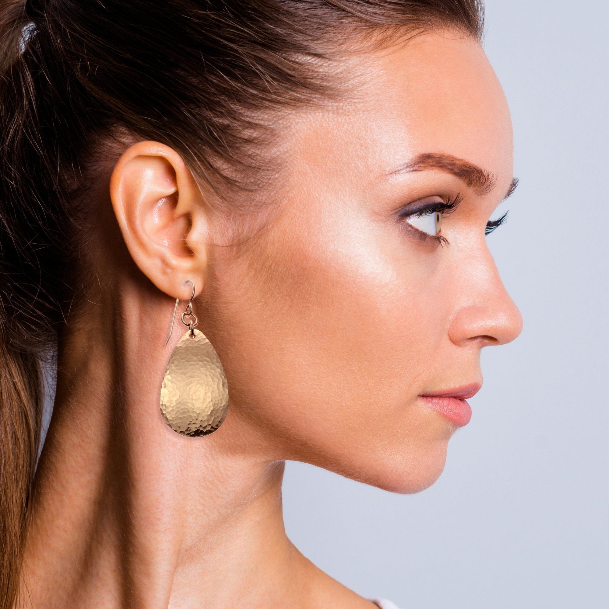 Female Model Wearing Hammered Bronze Teardrop Earrings