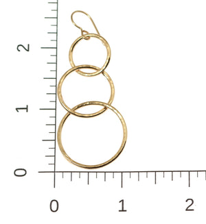 5 of 8: Scale of Hammered Bronze Three Tiered Dangle Earrings on a Ruler for Size Dimensions