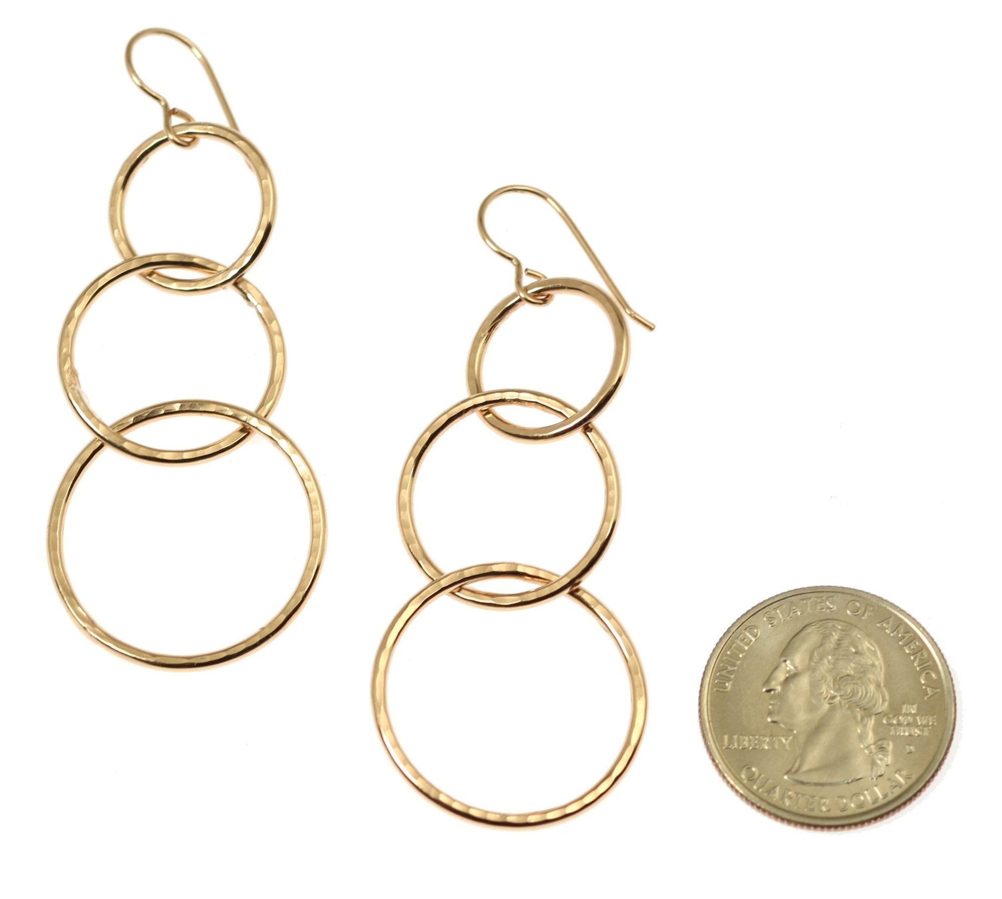 Size of Hammered Bronze Three Tiered Dangle Earrings compared to a US Quarter Coin