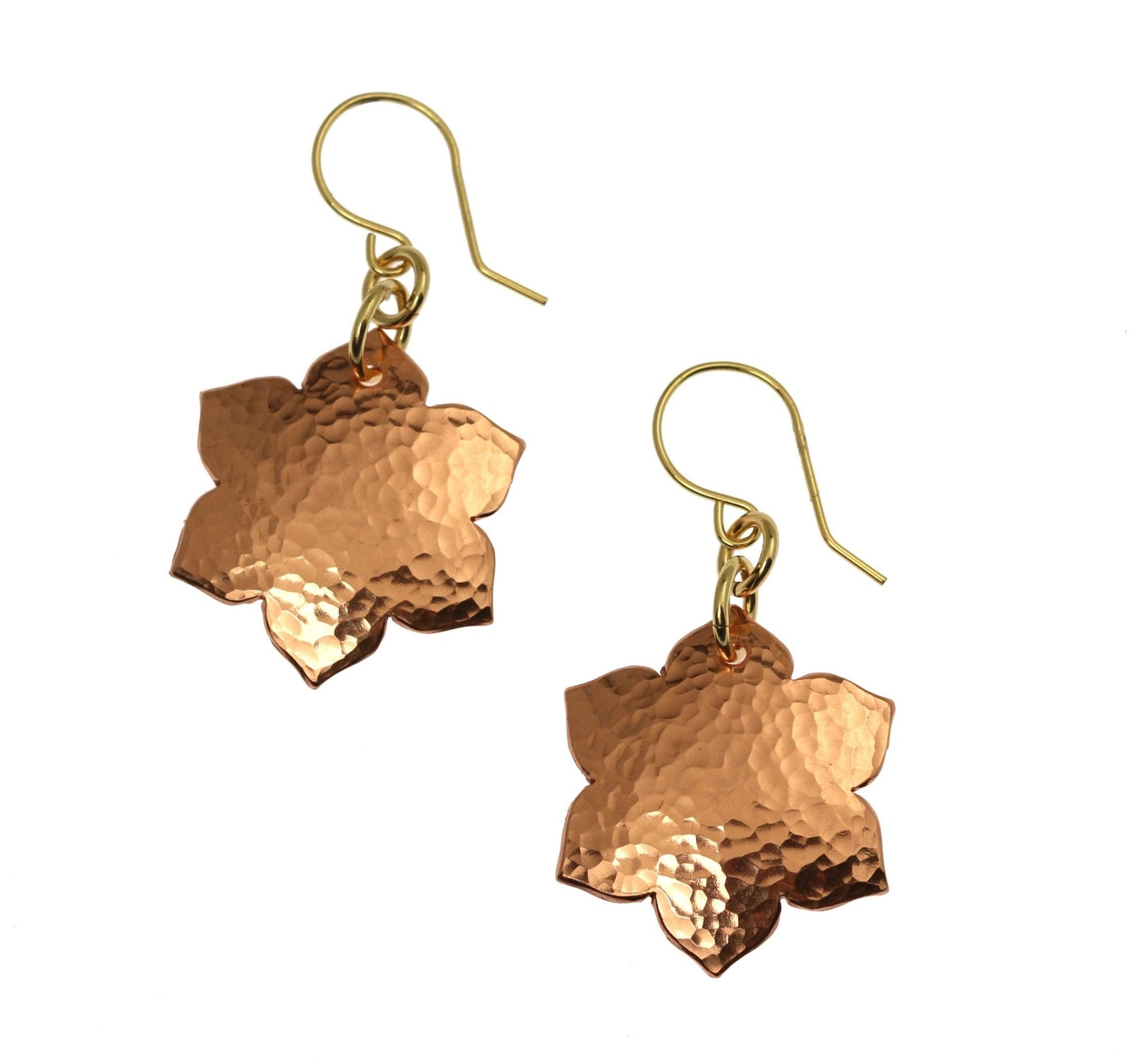 A Pair of Hammered Copper Arabesque Flower Earrings on a White Background