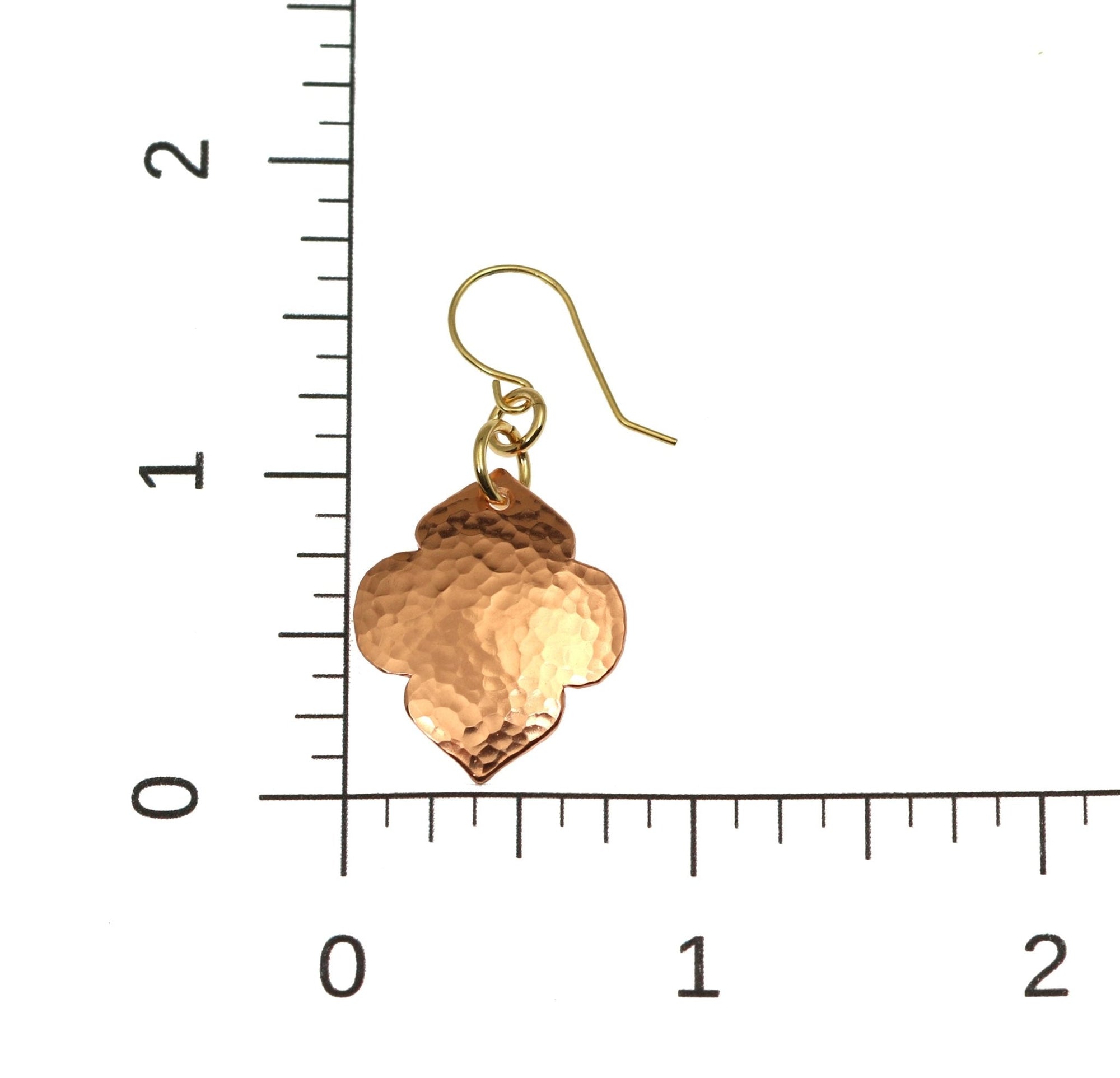 Scale of Hammered Copper Quatrefoil Dangle Earrings on a Ruler for Size Dimensions