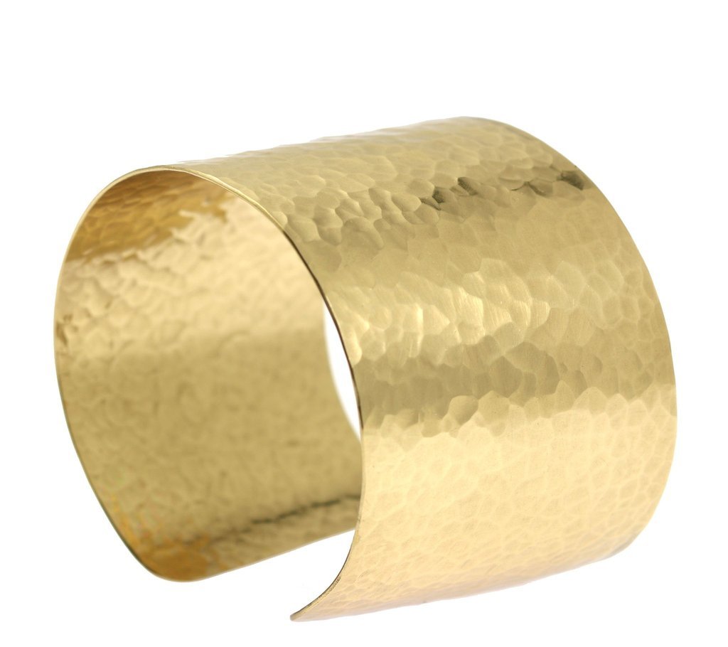 A Hammered Nu Gold Brass Cuff on a White Background
