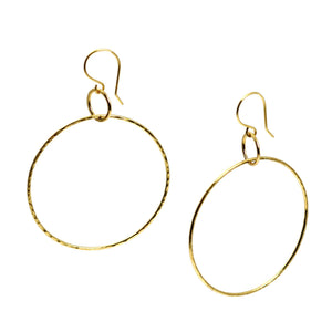1 of 5: A Pair of Hammered Nu Gold Brass Hoop Earrings on a White Background
