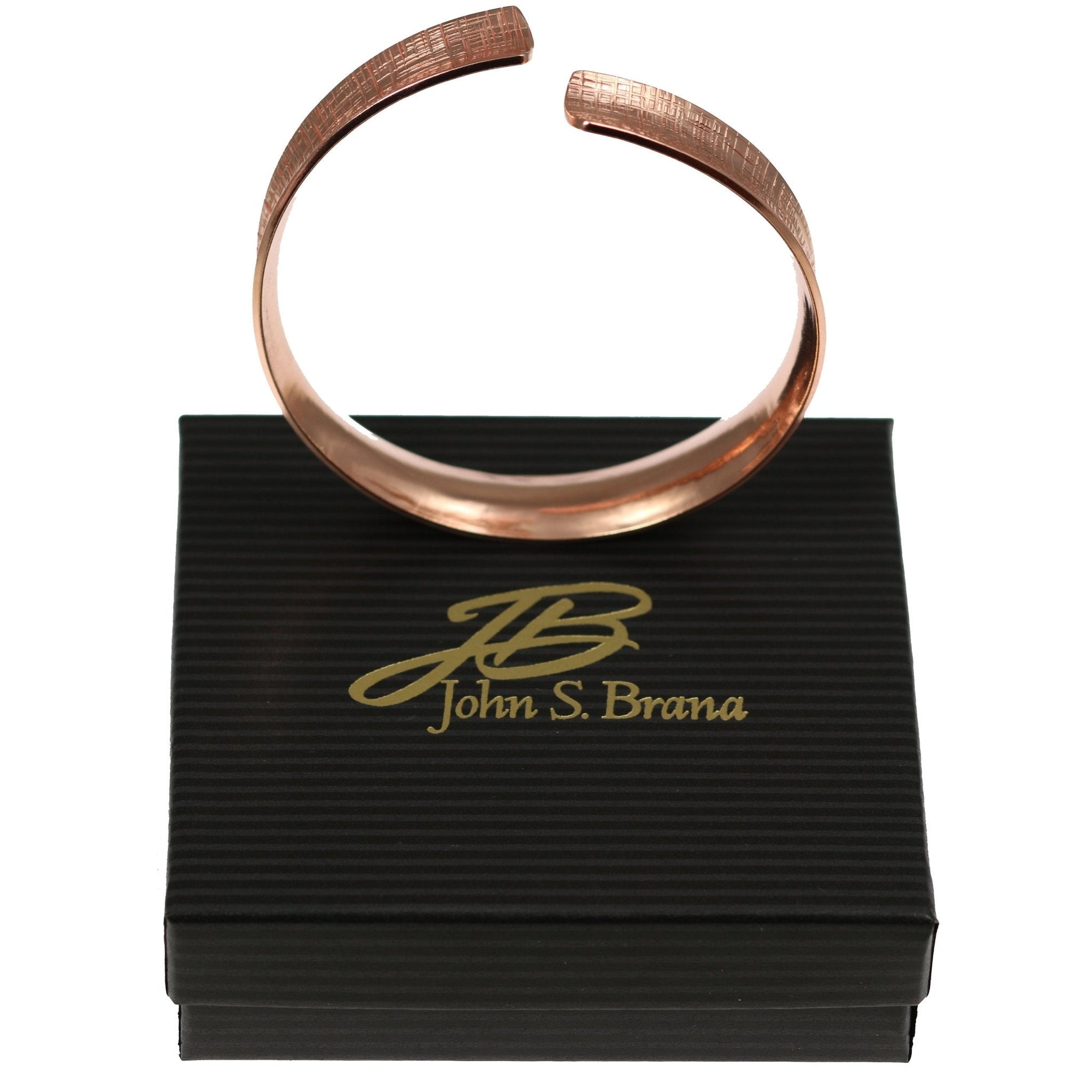 Linen Anticlastic Copper Bangle Bracelet on Top of a Black Gift Box