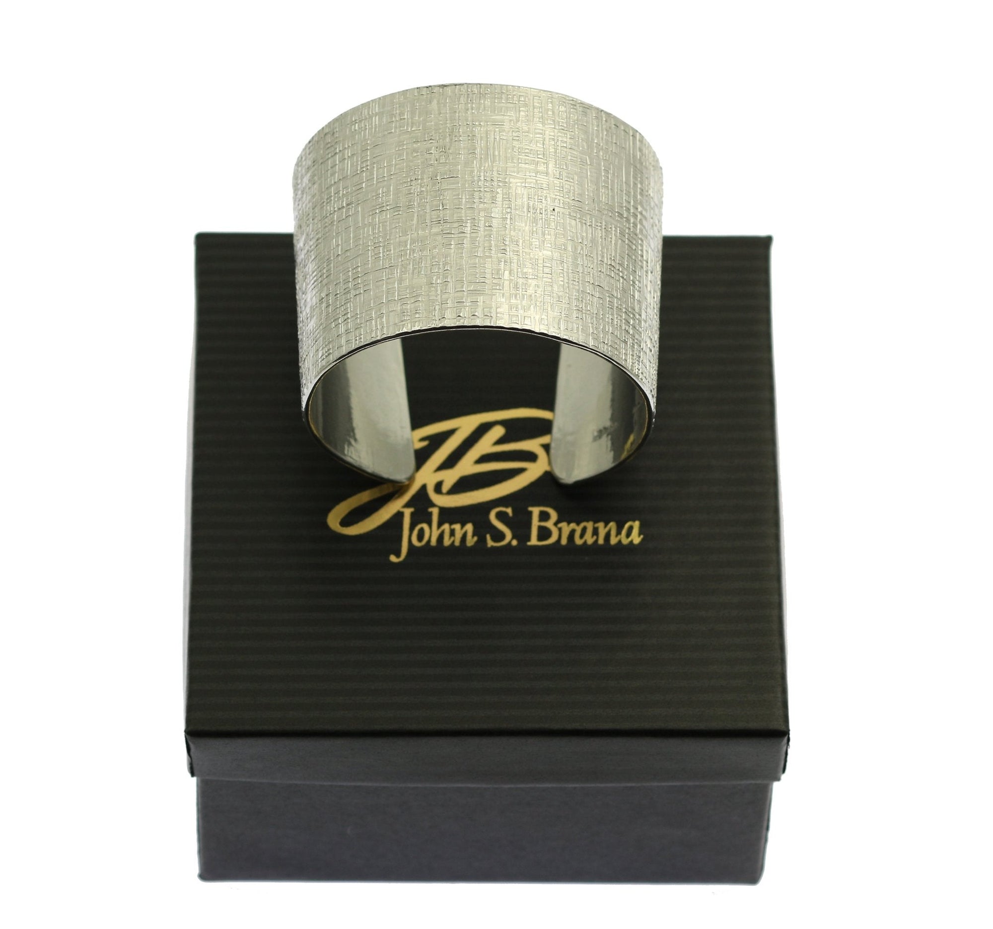 Linen Texturized Aluminum Cuff on Top of a Black Branded Gift Box