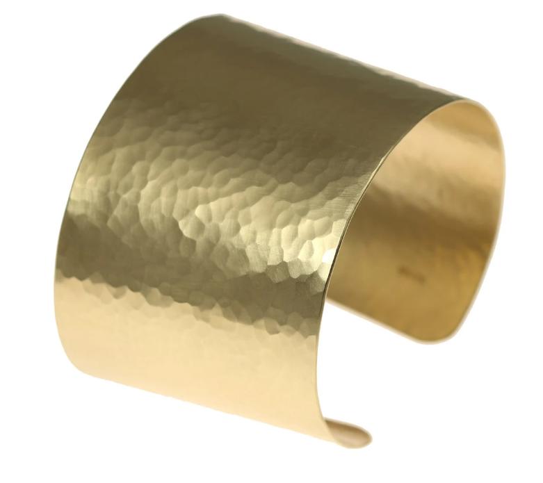 A Matte Finished Hammered Nu Gold Brass Cuff on a White Background