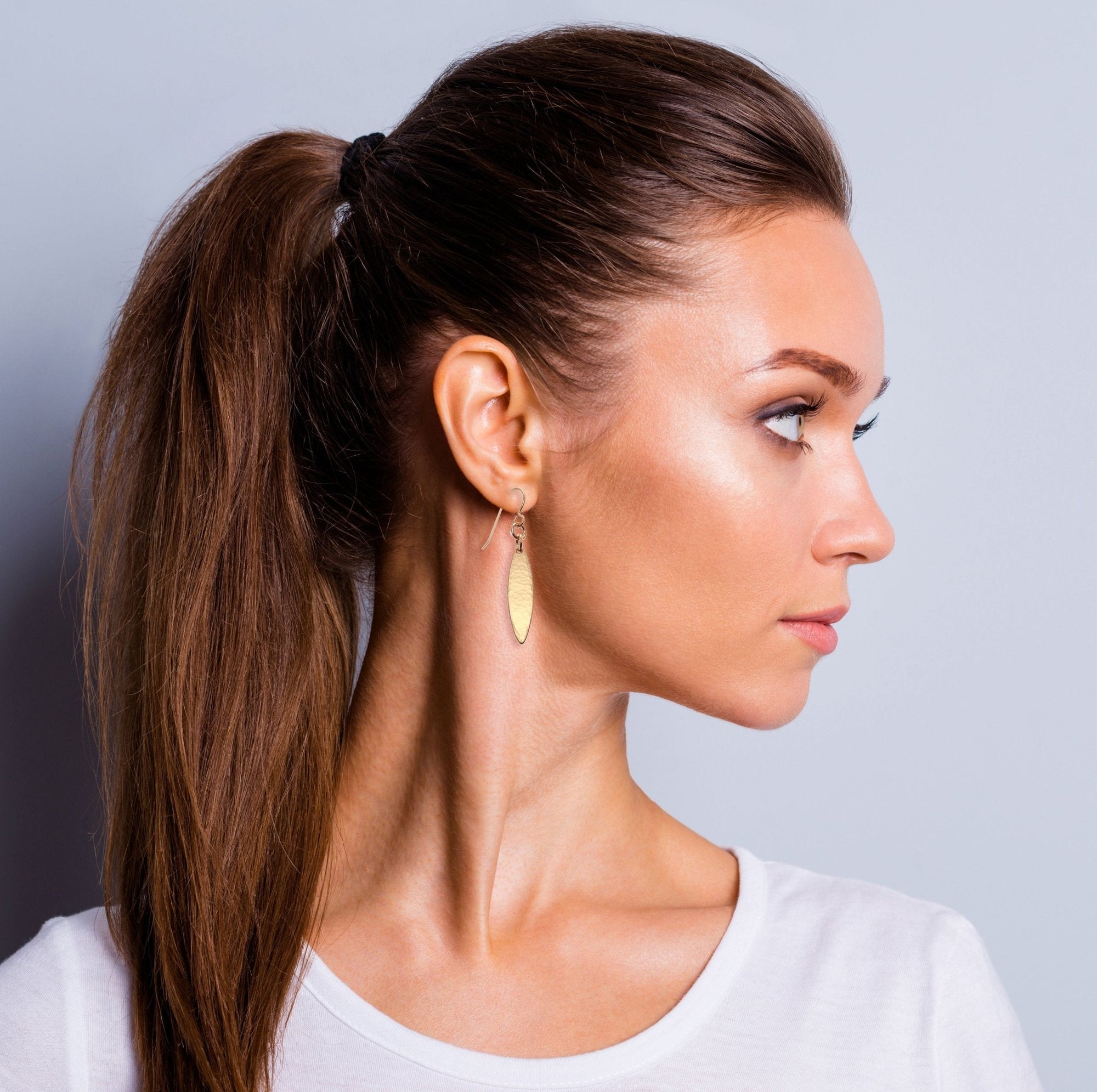 Mini Marquise Hammered Bronze Drop Earrings on Female Model