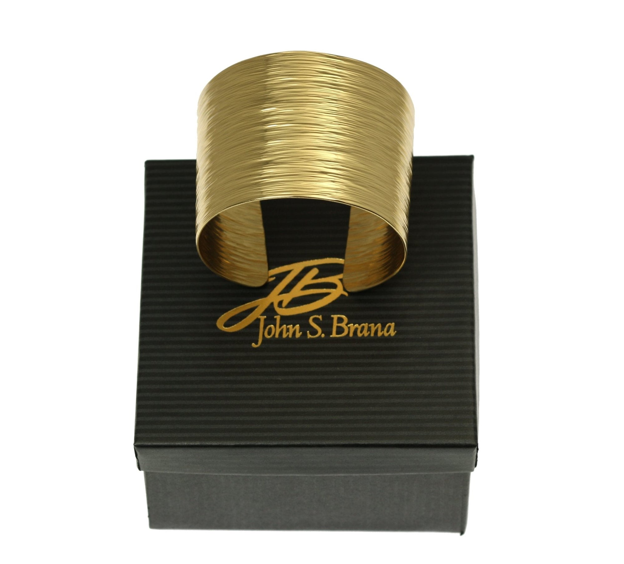 Nu Gold Brass Bark Cuff on Top of a Black Gift Box