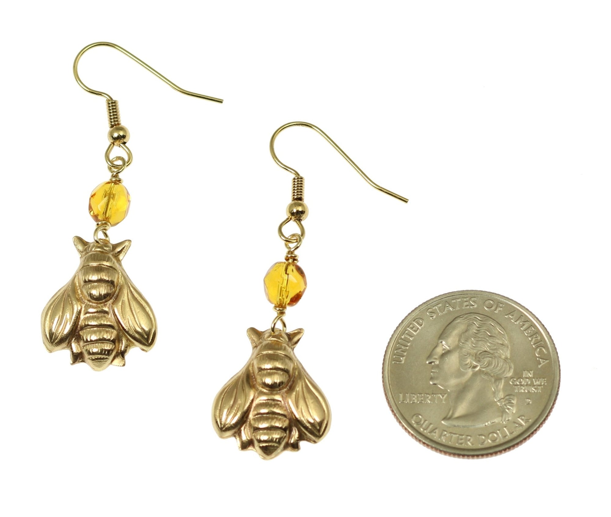 Size of Nu Gold Honey Bee Earrings with Amber compared to a US Quarter Coin