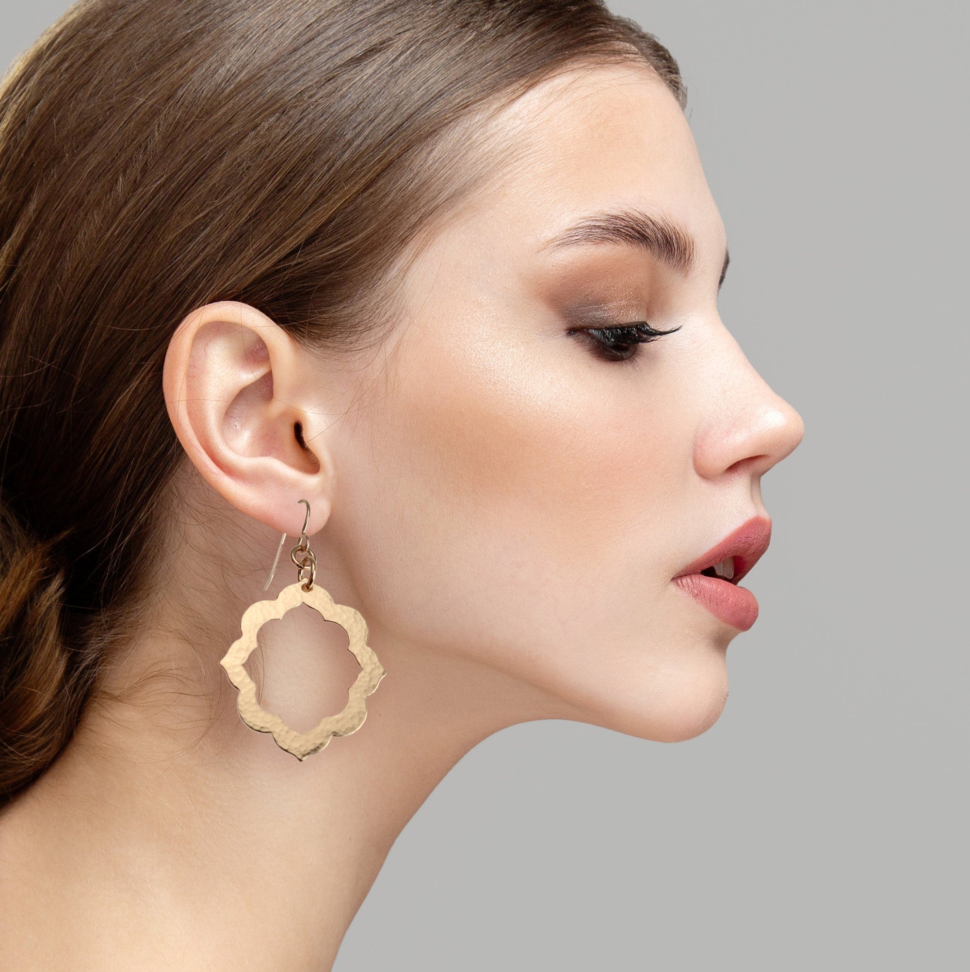 Pierced Hammered Bronze Arabesque Flower Earrings on Model
