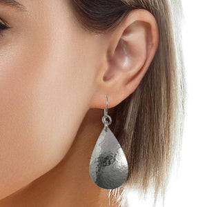 2 of 5: Small Hammered Stainless Steel Teardrop Earrings on Model