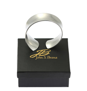 8 of 8: Tapered Brushed Anticlastic Aluminum Bangle on Top of a Gift Box