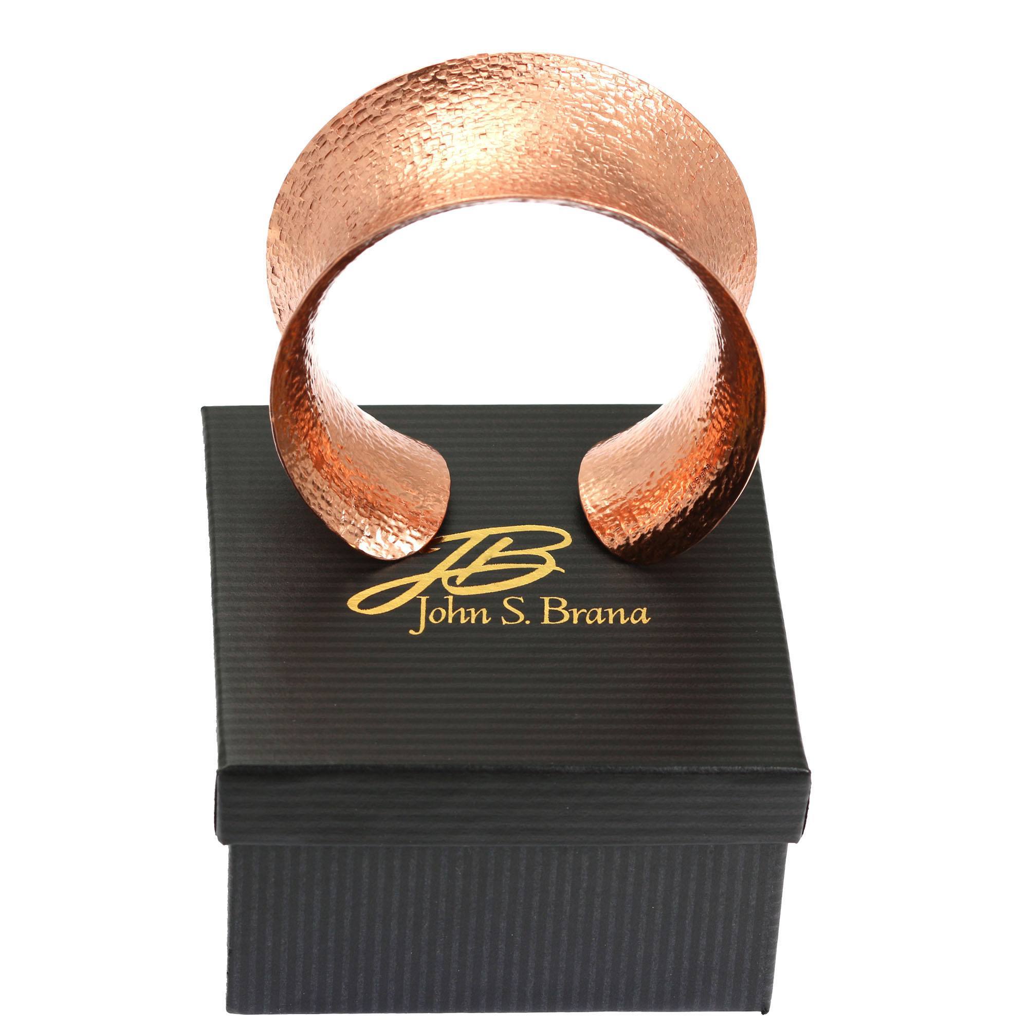 Texturized Copper Cuff Bracelet on Top of a Black Gift Box