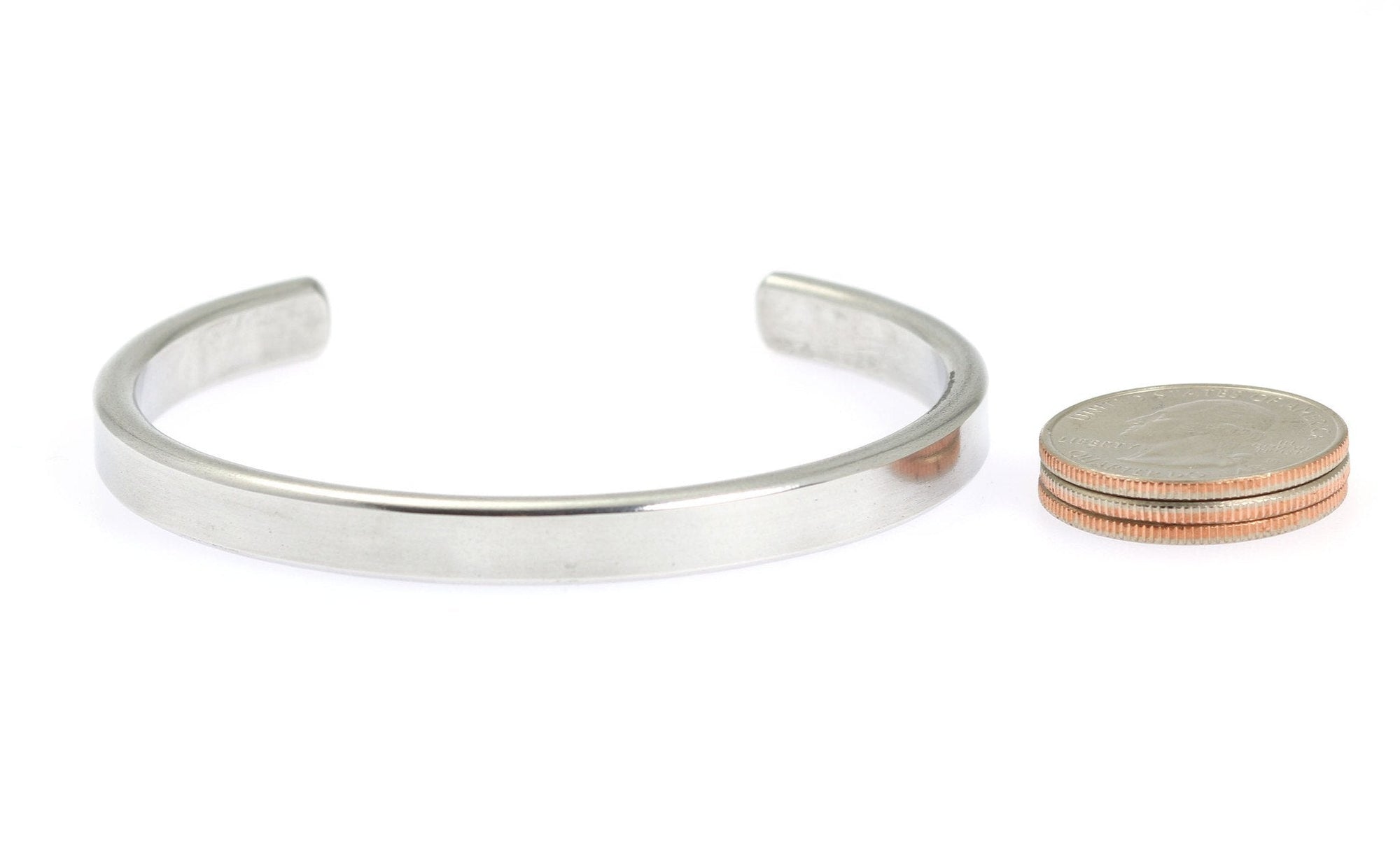 Width of Thin Brushed Aluminum Cuff Bracelet compared to a stack of US Quarter Coins