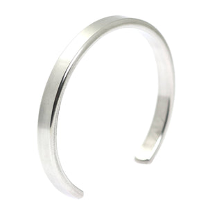 1 of 7: A Thin Brushed Aluminum Cuff Bracelet on a White Background
