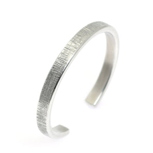 3 of 7: Left View of Thin Linen Aluminum Cuff Bracelet
