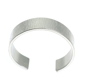 6 of 8: Shape of Chased Aluminum Cuff Bracelet on a White Background